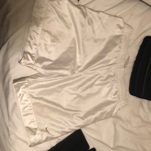 White NIKE basketball shorts.